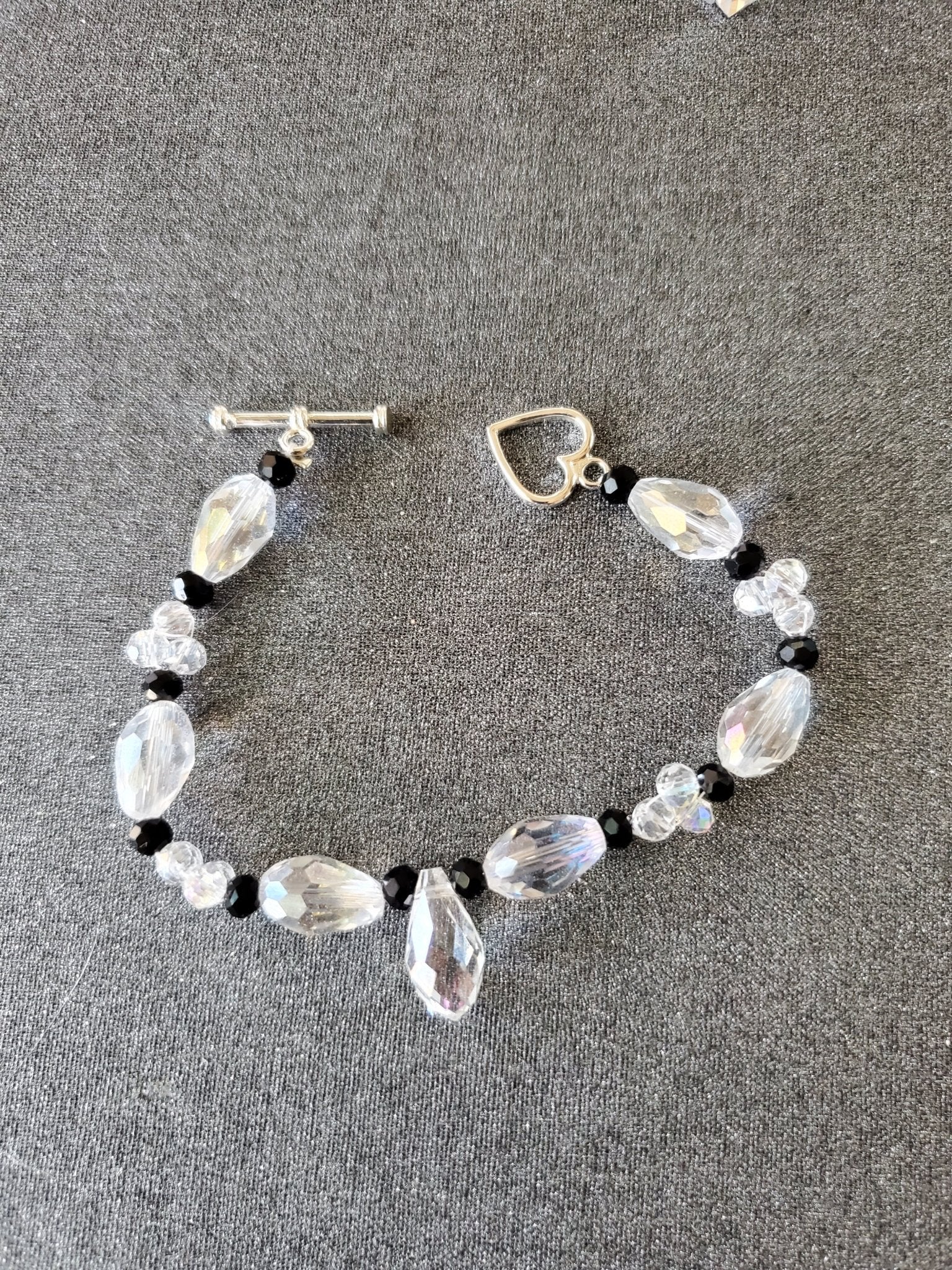 6in Elegant black and clear glass bead bracelet with single glass drop charm. - Arts & Scraps