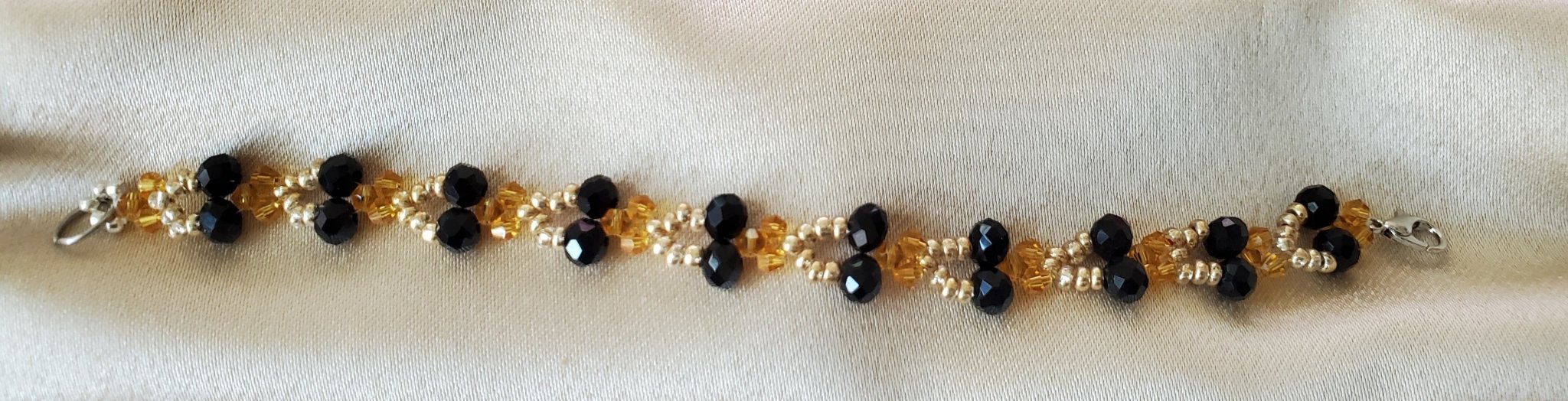 Sleek black and gold glass bead bracelet - Arts & Scraps